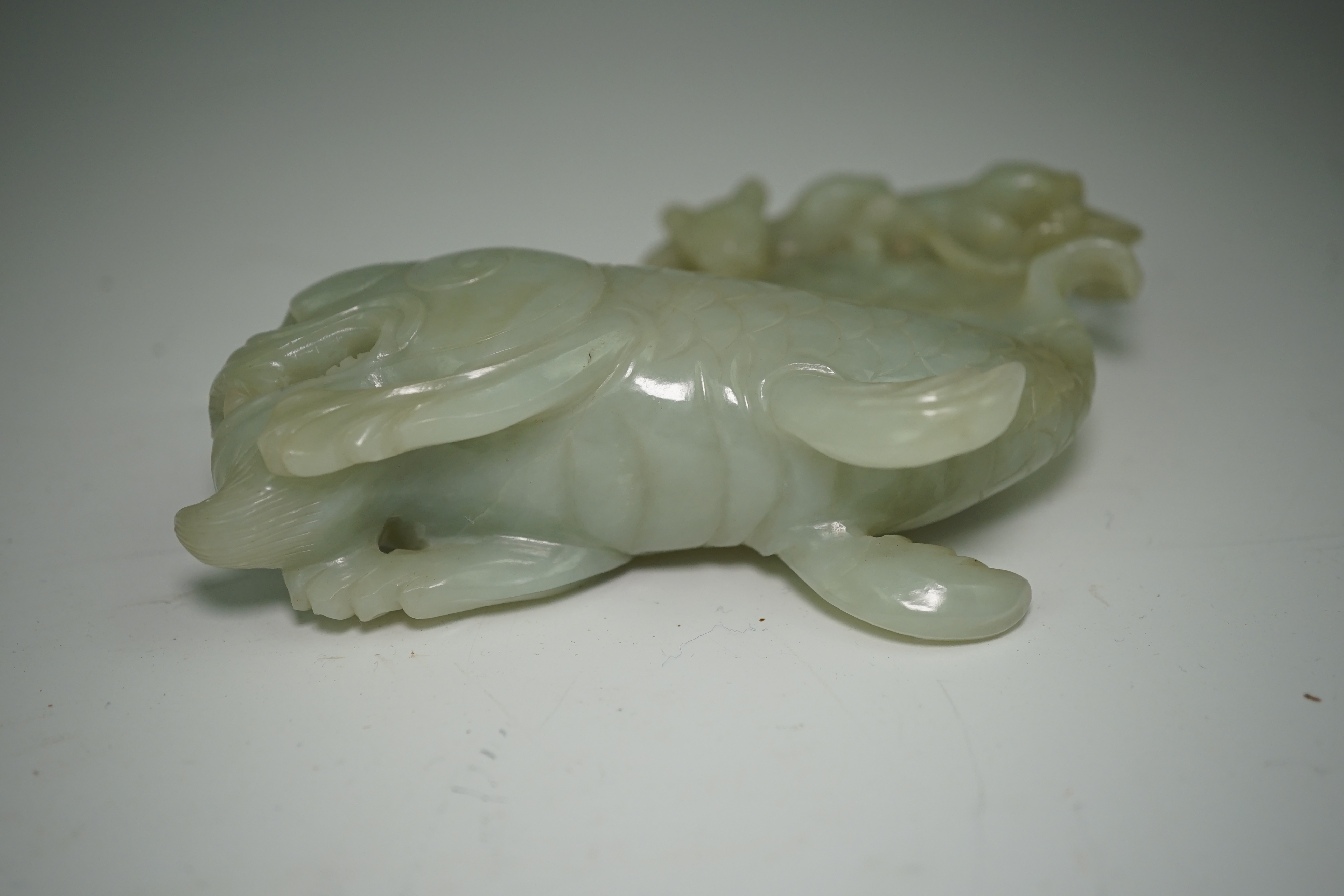 A large Chinese pale celadon jade ‘dragon-fish’ vessel and cover, 19th century